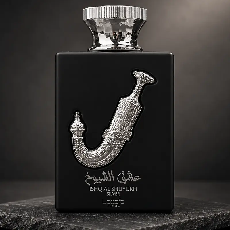 Macro detail of the metallic sword emblem and premium glass finish on the Ishq Al Shuyukh Silver parfum bottle.