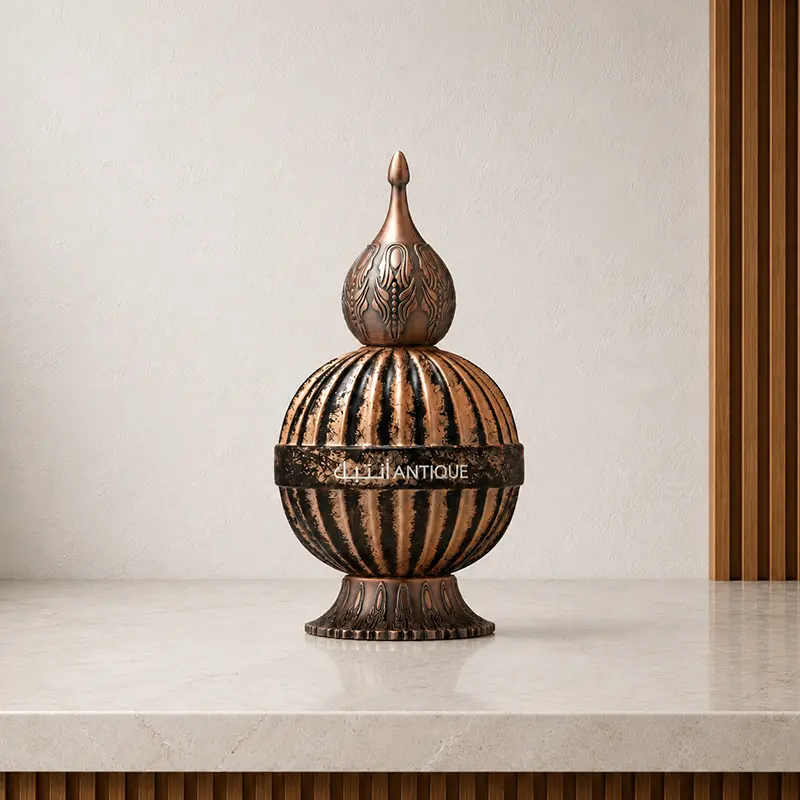Ornate Niche Emarati Antique bottle shown upright from the front with its decorative cap fitted.