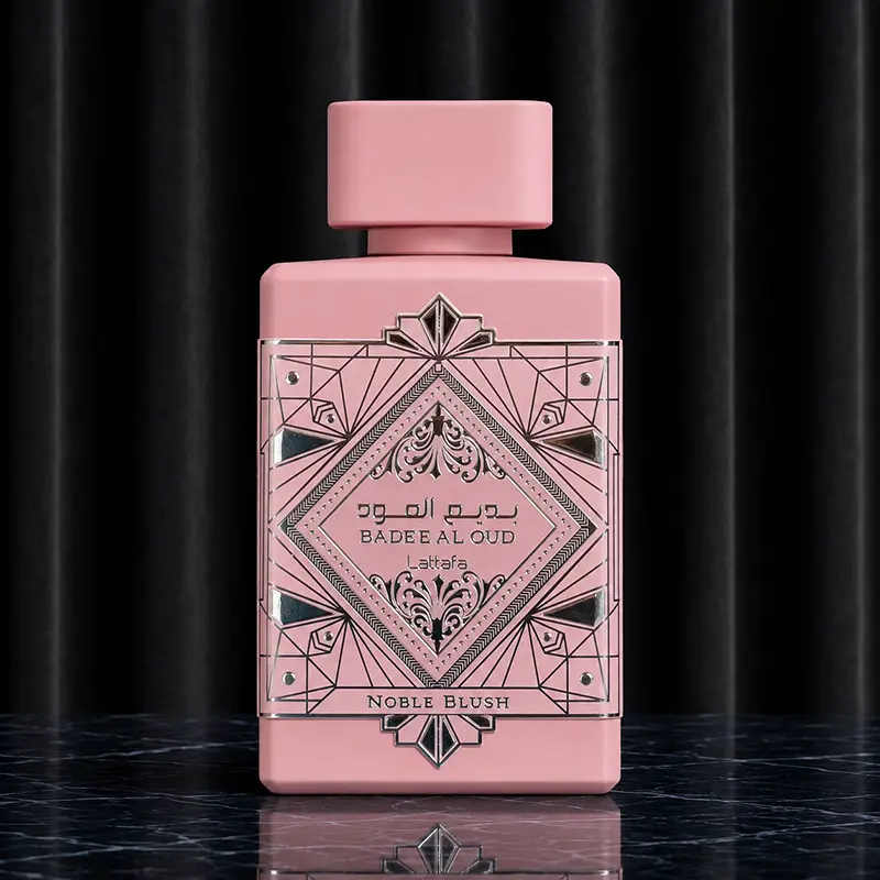 Front shot of the rectangular pink matte 100ml bottle with its intricate silver relief artwork and matching pink cap.