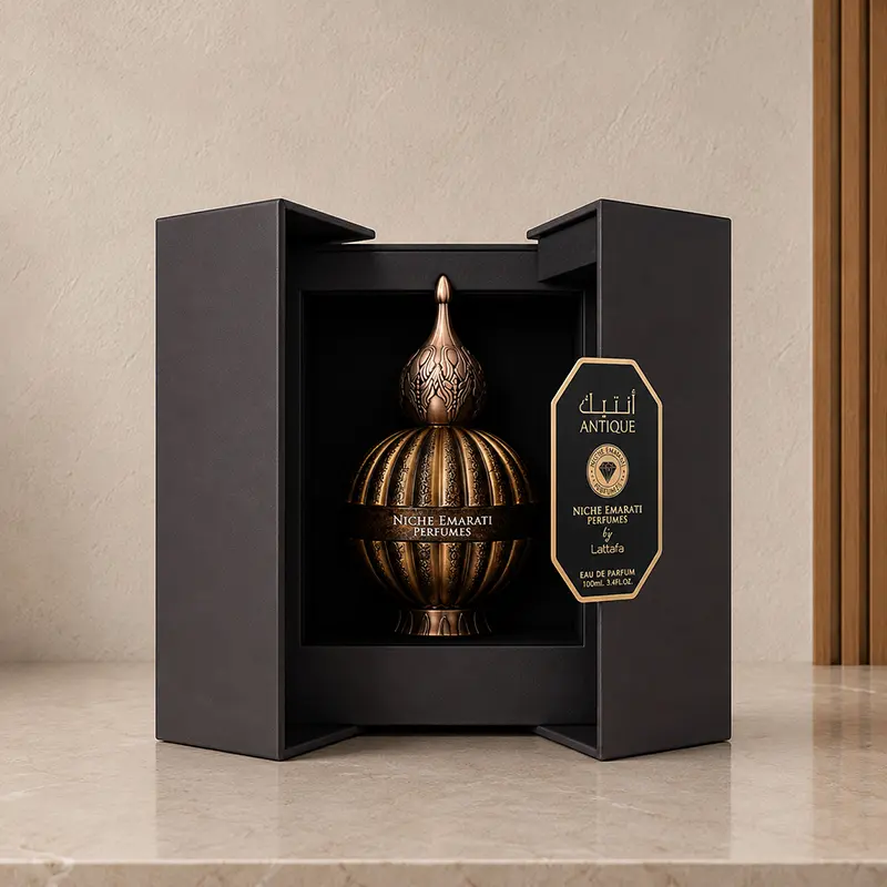 Open dark presentation box displaying the Antique bottle inside with a gold-edged branded panel.