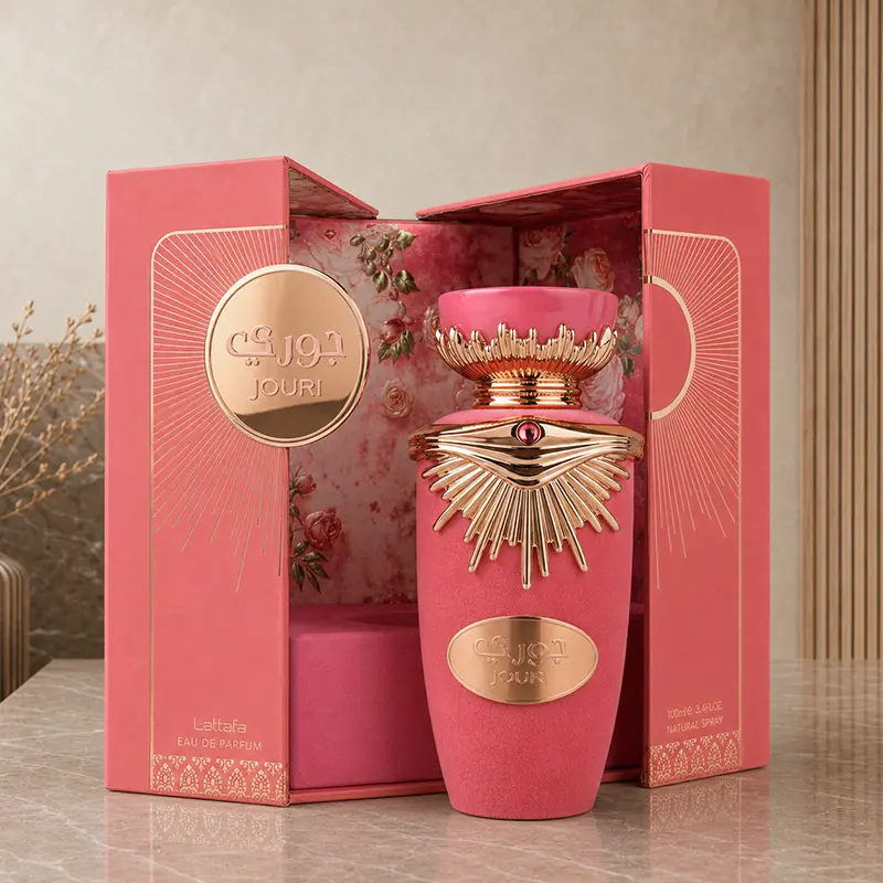 Floral interior of the open Lattafa Jouri presentation box displayed behind the pink perfume bottle.