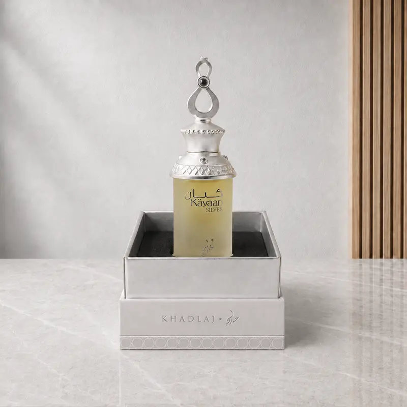 Open silver presentation box holding the Kayaan Silver perfume oil bottle upright inside