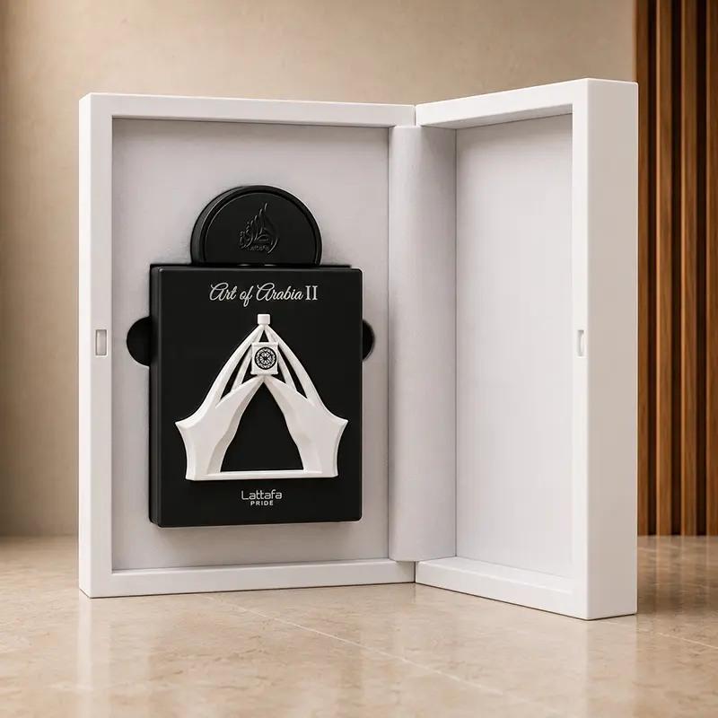 Opened white presentation box displaying the black Art of Arabia II bottle in its fitted interior.