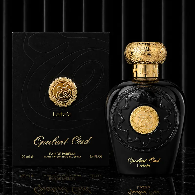 Golden 100ml perfume bottle standing next to its elegant black display box.
