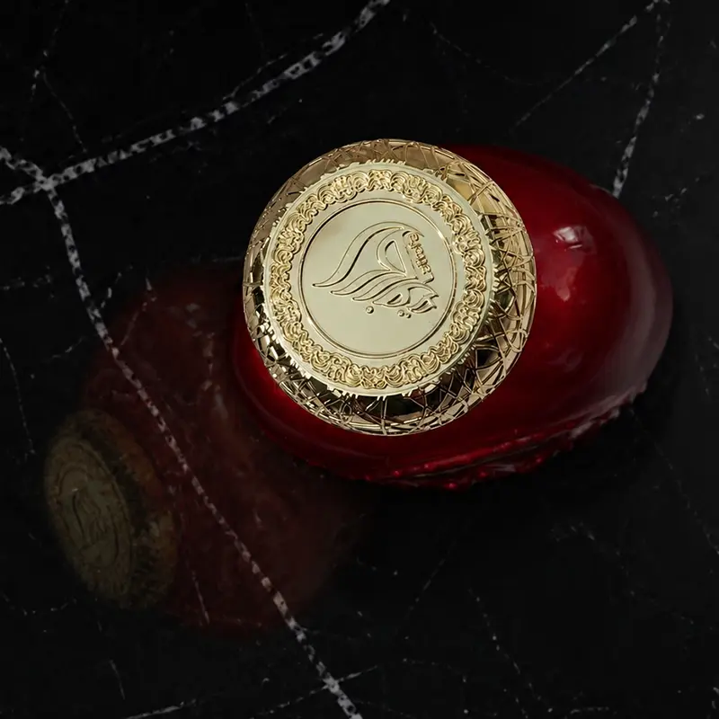 High-angle closeup showing the precise finish and texture on top of the signature metallic cap.