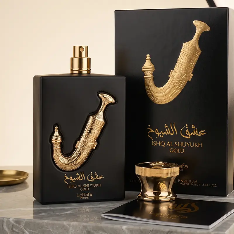 Complete authentic niche perfume presentation featuring the box, bottle, and cap of Ishq Al Shuyukh Gold.