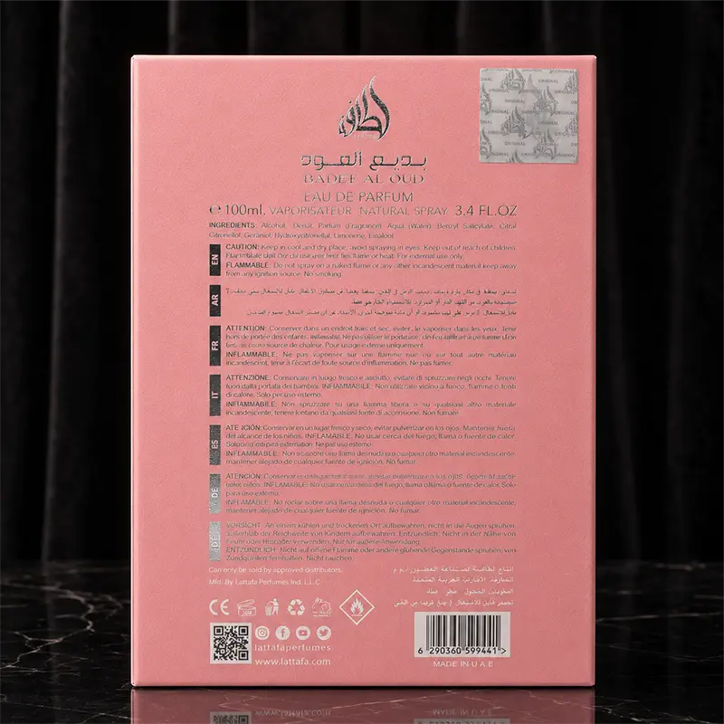The reverse side of the pink perfume box featuring multi-language warnings, ingredients list, and authentic hologram sticker.