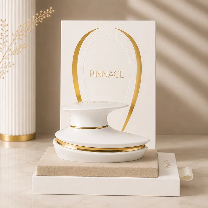 Premium Pinnace Blanc bottle and presentation box styled in a modern European luxury setup.