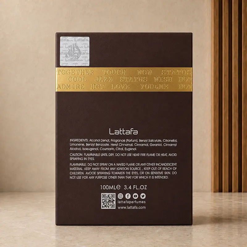 Back of Ramz Lattafa Gold box showing Lattafa branding, ingredients, warnings, QR code and 100ml size.