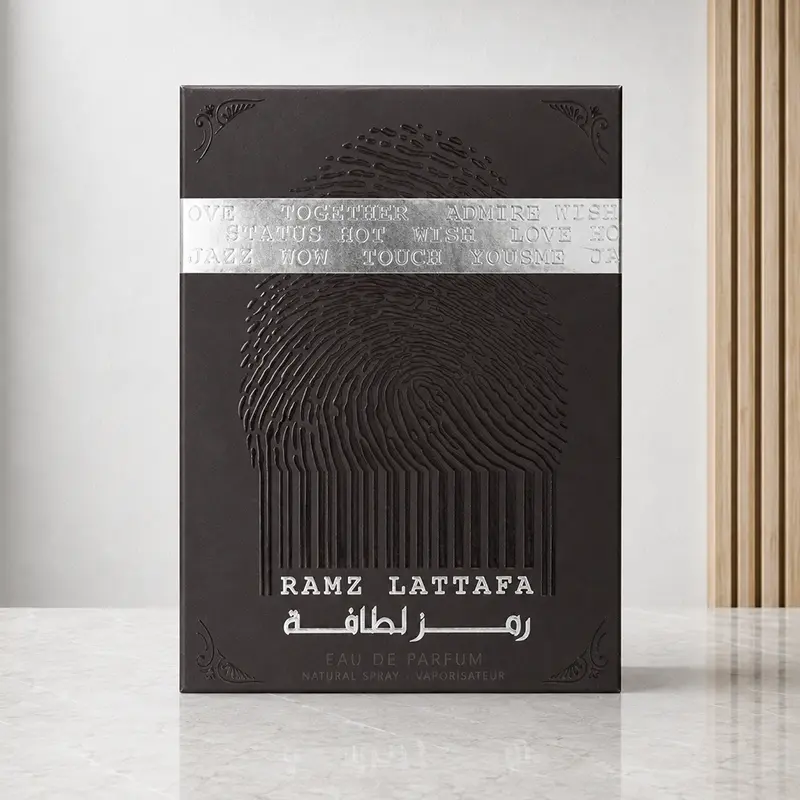 Ramz Lattafa Silver box front with fingerprint embossing and a reflective silver word band.