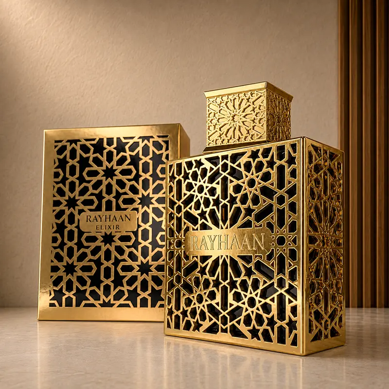 Angled studio view of the Rayhaan Elixir gold bottle with its matching patterned box behind.