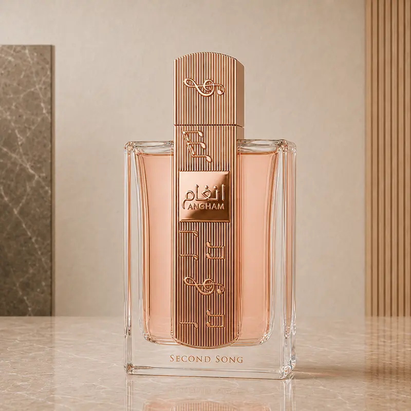 Rose-gold ribbed Angham Second Song bottle shown upright with clear glass and peach-toned liquid.