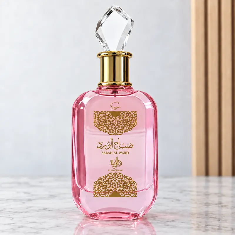 Full-front view of the Al Wataniah Sabah Al Ward Sugar bottle with pink glass and ornate gold decoration.