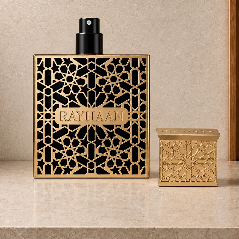 Exposed black spray nozzle on the Rayhaan Elixir bottle, with the matching gold cap placed beside it.