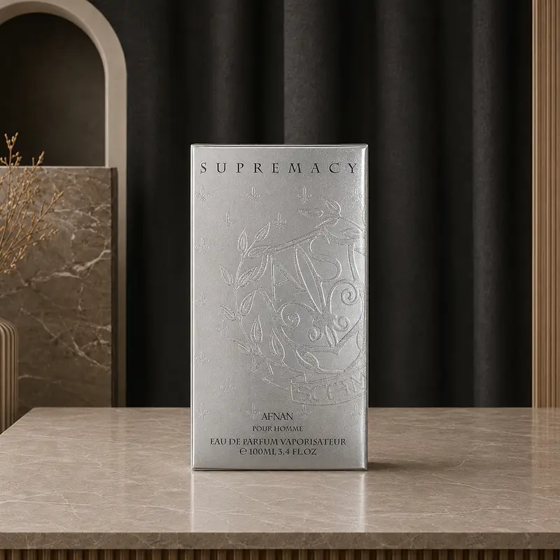 Silver Supremacy Silver 100ml Eau de Parfum box by Afnan stands upright on a marble studio counter