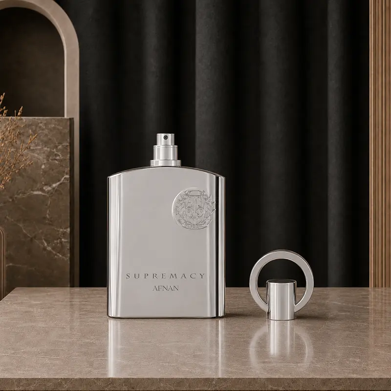 Chrome Supremacy Silver bottle shows its exposed spray nozzle beside the detached circular ring cap