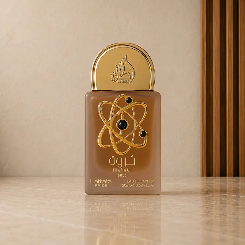 20 ml Tharwah Gold mini Eau de Parfum bottle with gold cap and orbit-style front motif.