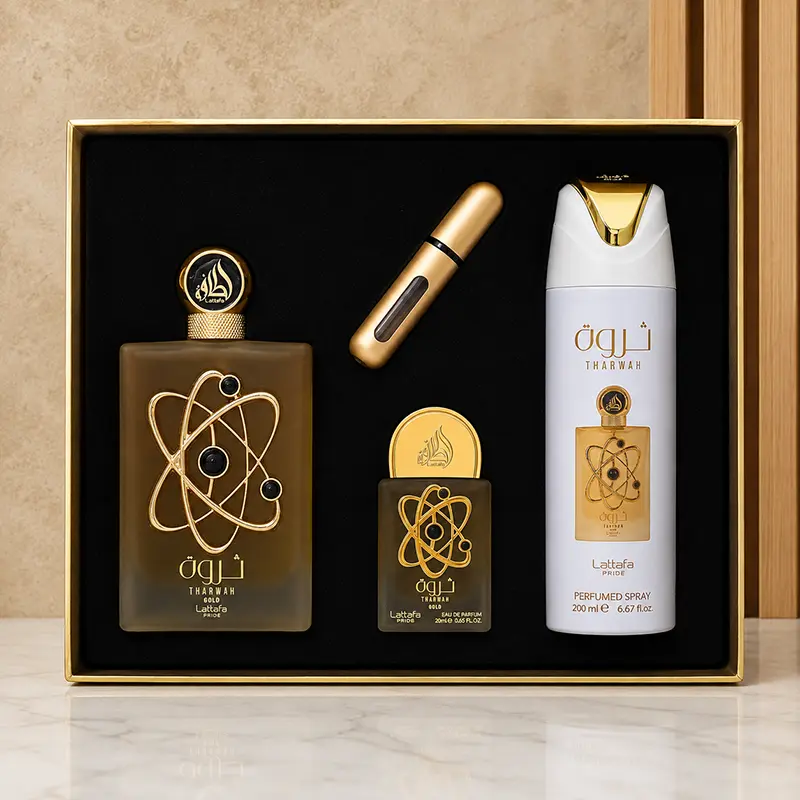 Open Tharwah Gold gift box showing perfume, mini EDP, 200 ml perfumed spray and gold atomiser.