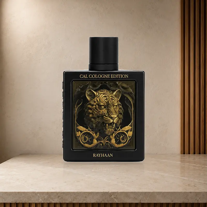 Rayhaan Tiger black perfume bottle with gold tiger artwork and Rayhaan branding on a stone surface.