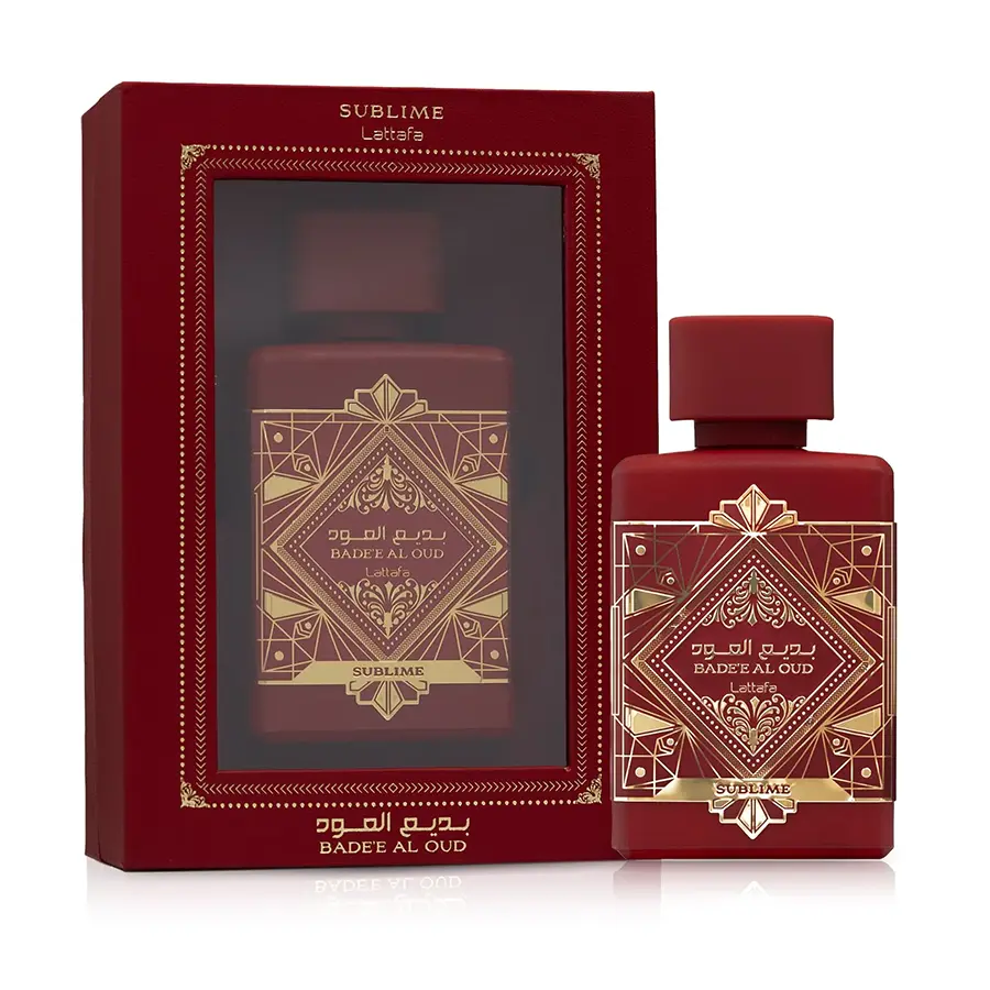 Crimson red bottle of Lattafa Badee Al Oud Sublime Eau de Parfum next to its luxury display window box packaging.