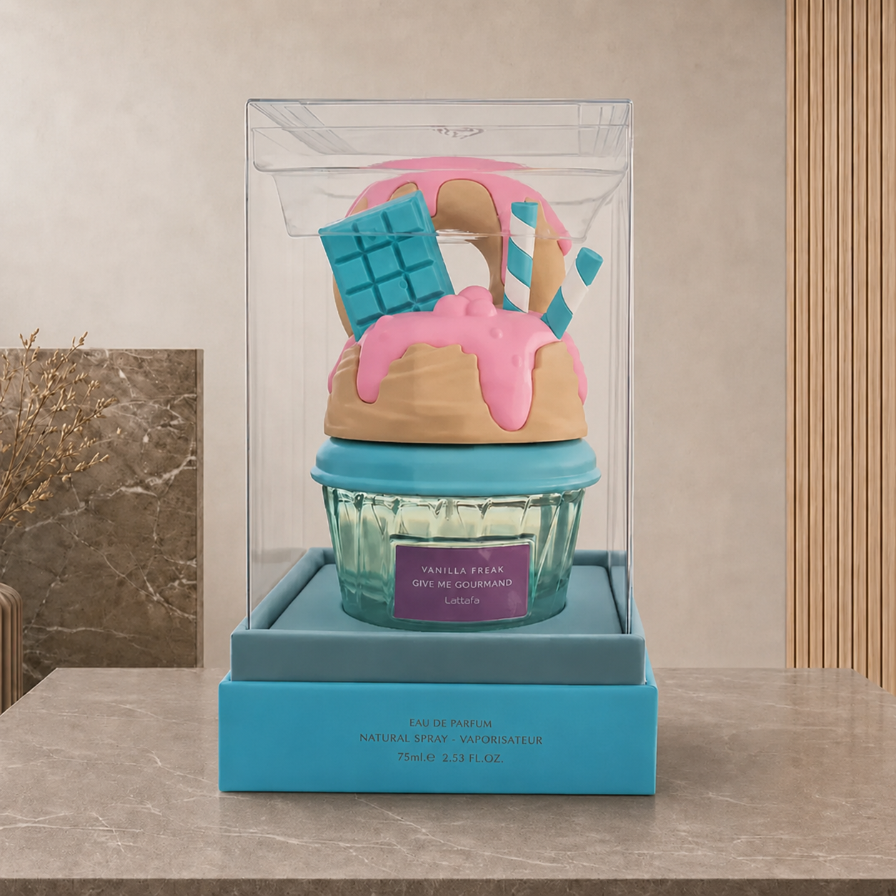 Clear presentation case holding the Vanilla Freak bottle above a turquoise base.