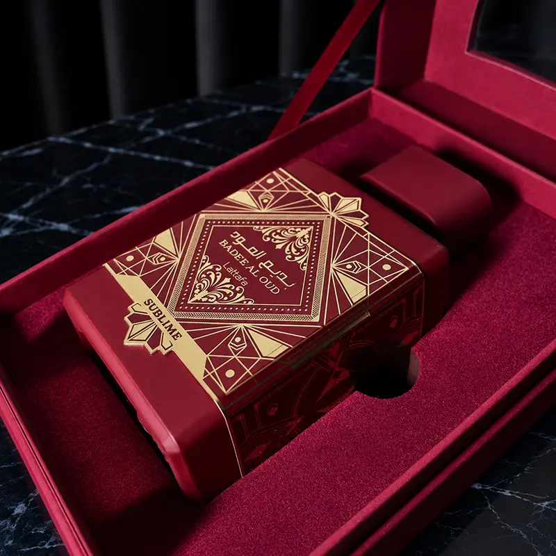 The red matte bottle with gold accents resting securely inside its premium velvet-lined presentation box.