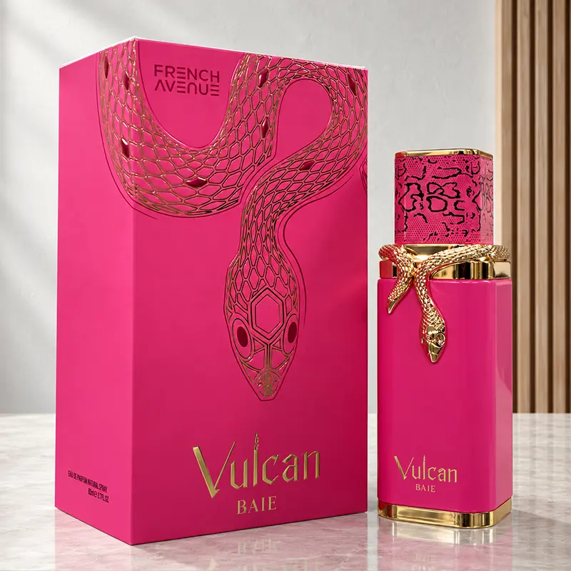 Angled view of the Vulcan Baie pink box beside its capped bottle on a pale marble surface.