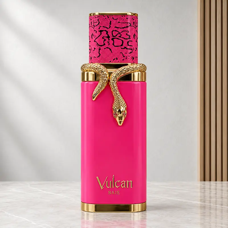 Front view of the pink Vulcan Baie bottle with gold-coloured snake ornament and patterned cap.