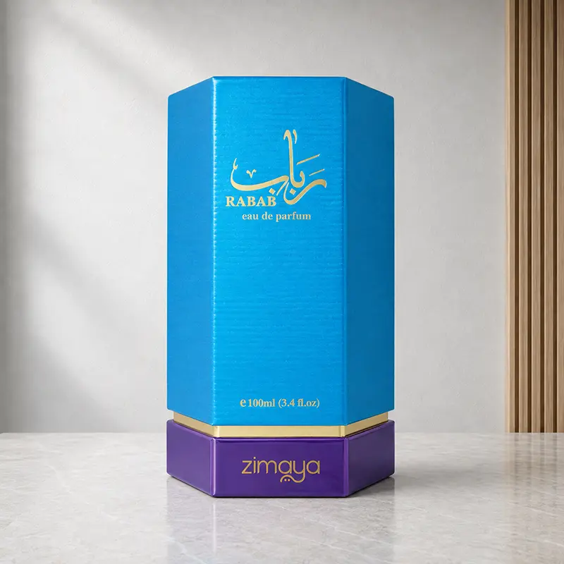 Blue Rabab Eau de Parfum box with gold details and purple base on a marble studio surface.